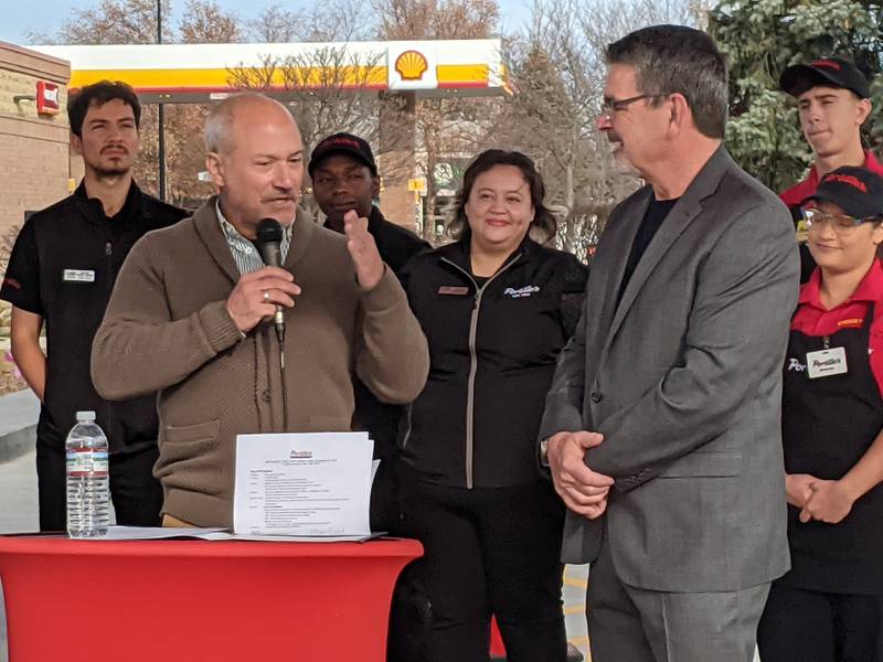 Plainfield Mayor John Argoudelis, left, addresses Portillo's Vice President of Restaurant Support Michael Portillo, right, during a ribbon-cutting ceremony at the new Portillo's restaurant at the corner of 135th Street and Route 59 on Nov. 24, 2025.