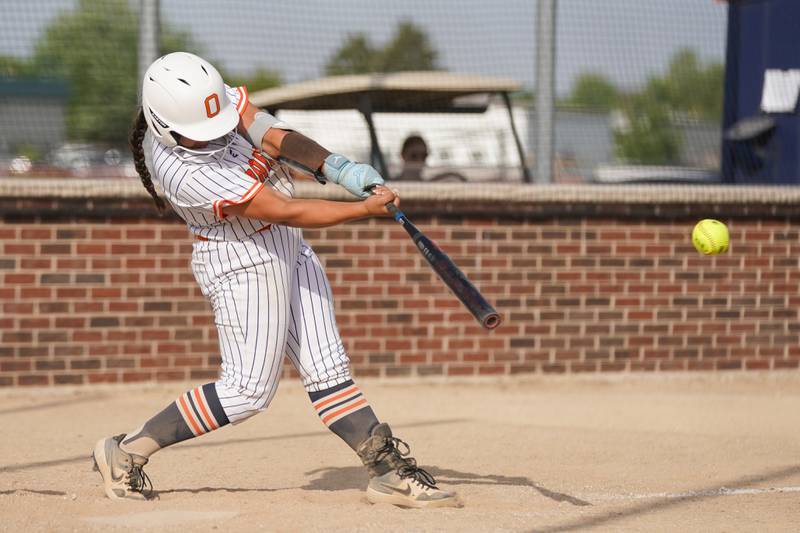 Oswego’s Aubriella Garza cracks a double against Yorkville during a softball game at Oswego High School on Thursday, May 15, 2025.
