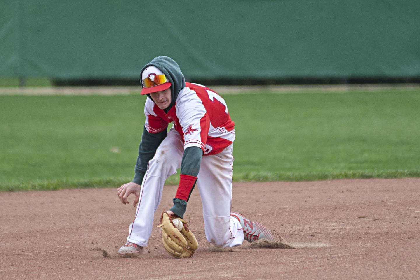 Oregon shortstop Miley Smith snags a grounder in the hole Monday, April 25, 2022 against Rock Falls.