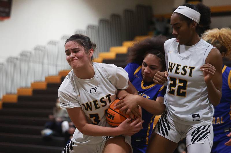 Joliet West’s Natalie Clemente rips the ball away from Joliet Central’s Melani Tua-Link on Thursday, Jan 30, 2025 in Joliet.