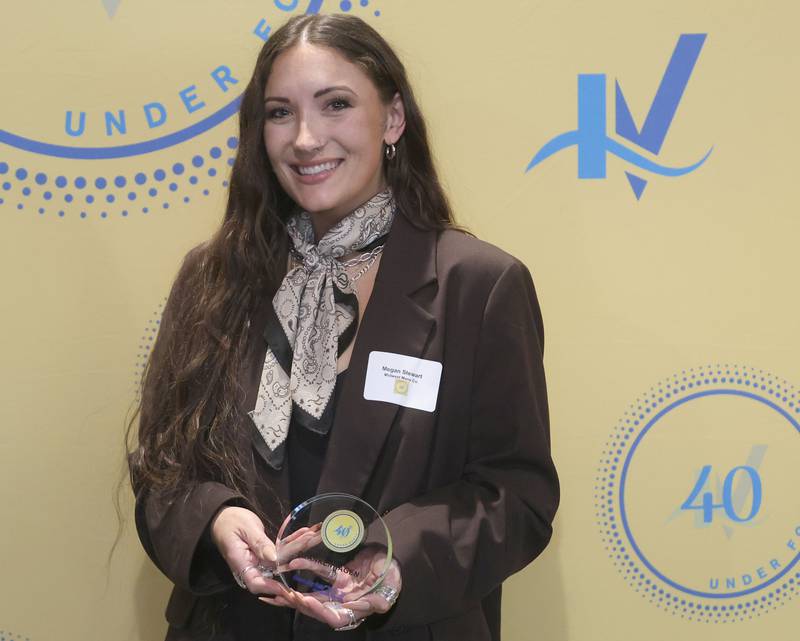 Megan Blankenhagen Stewart poses with her 40 Under Forty award during the Illinois Valley Chamber of Commerce Champions of Change Awards Night on Wednesday, May 6, 2026 at the Westclox Event Center in Peru.