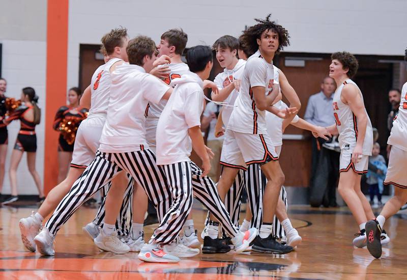 Wheaton Warrenville South celebrate their 42-41 overtime against Lake Park at home on Saturday, Jan. 7, 2023.