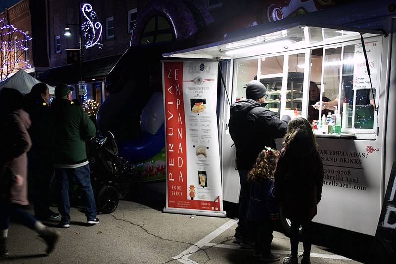Local restaurants and food trucks popped up along Main Street in downtown Oswego during the annual Christmas Walk celebration Dec. 3.