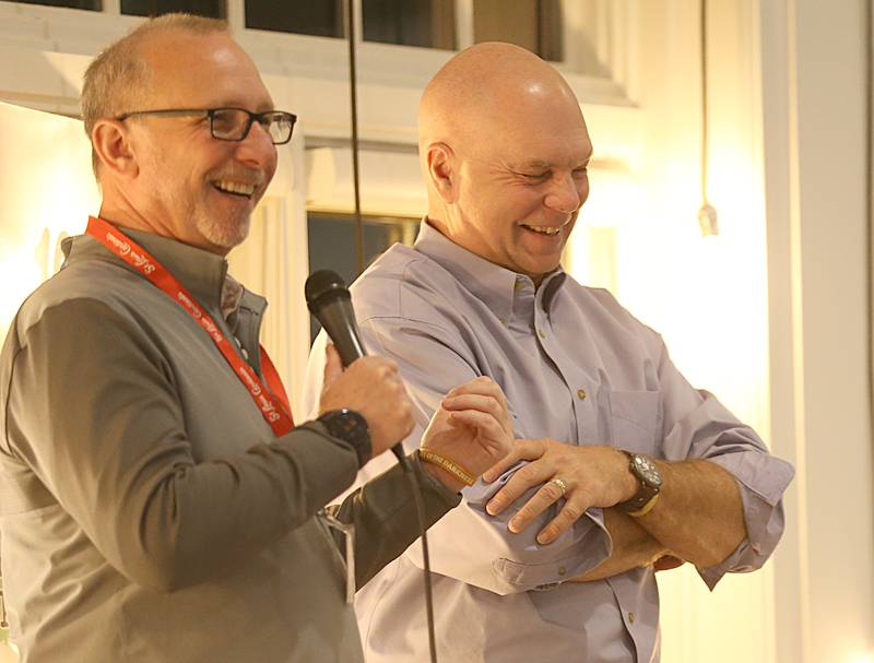 John Spencer, Starved Rock Media president and WLPO morning show host Rod Thorson share stories on stage during the WLPO 75th Anniversary party on Wednesday, Nov. 16, 2022 at Senicas Oak Ridge in La Salle.