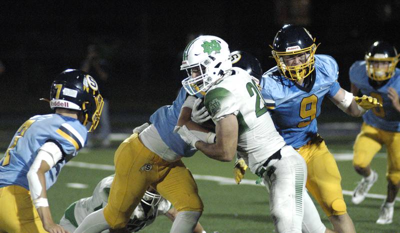 Sterling's defense swarms  a Niles North running back. Niles North traveled to Sterling High School to play the Warirors on Sept. 6, 2024