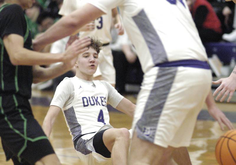 Dixon player Brody Nicklaus slips bringing the ball upcourt. Dixon hosted Rock Falls in boys basketball Friday, February 14, 2025 at Lancaster Gym at Dixon High School. Rock Falls won a hard fought game 48-46.