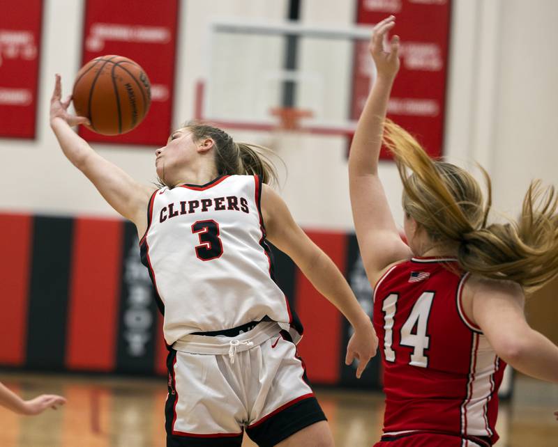 Amboy’s Elly Jones reaches back for a rebound against Hall Wednesday, Dec. 27, 2023 during the Amboy Holiday Basketball tournament.