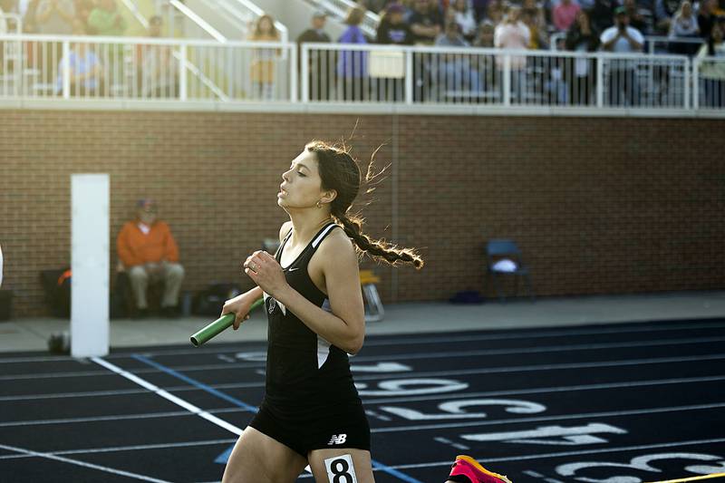 Rock Falls’ Gracie Rippy finishes the 4x800 Thursday, April 27, 2023  at the Sterling Night Relays.