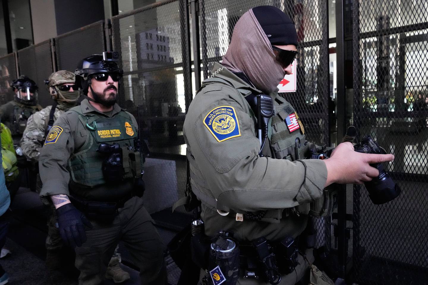 U.S. Customs and Border Patrol agents arrive to escort U.S. Customs and Border Patrol Gregory Bovino from federal court in Chicago, Tuesday, Oct. 28, 2025. (AP Photo/Nam Y. Huh)