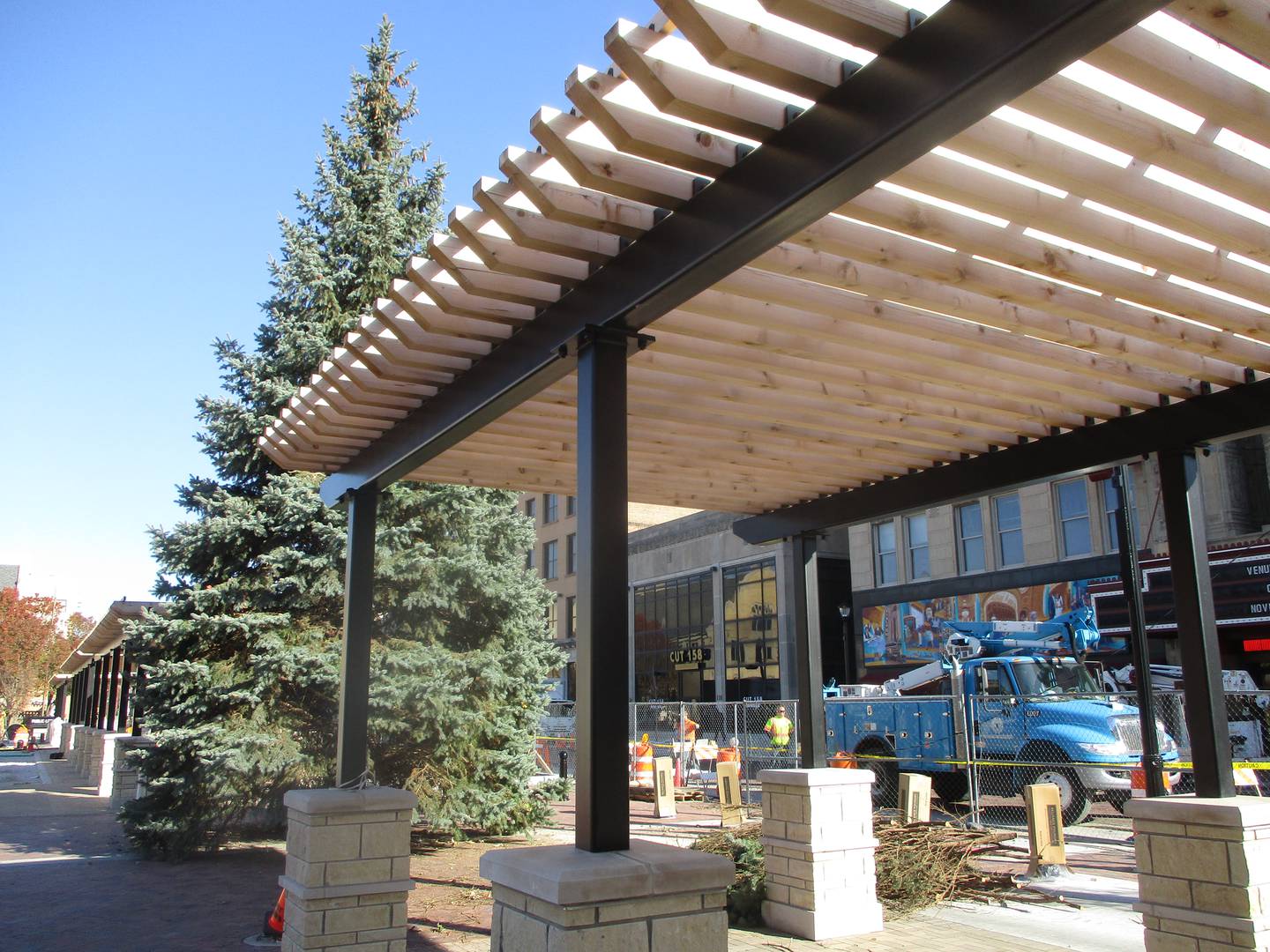 The shaded walkways on the Chicago Street edge of the new Joliet City Square will be open for the Light Up the Holidays Festival and Parade on Nov. 28. So will the area around the city Christmas tree. Nov. 15, 2025