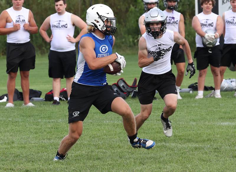Geneva’s Finn Weppner carries the ball after a catch Tuesday, July 16, 2024, during their matchup with Kaneland in the Kaneland 7-on-7 at the school in Maple Park.