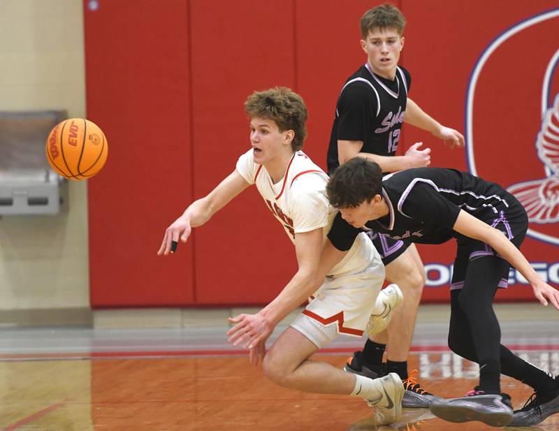 Oregon's Tucker O'Brien (5) knocks the ball away from two Rockford Lutheran players on Friday, Feb. 6, 2026 at the Blackhawk Center.