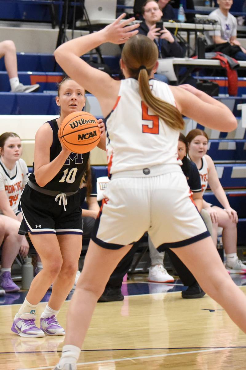 Manteno's Alyssa Singleton, left, shoots a 3-pointer as Pontiac's Morgan Dewald closes out during the IHSA Class 2A Pontiac Sectional championship Thursday, Feb. 26, 2026.