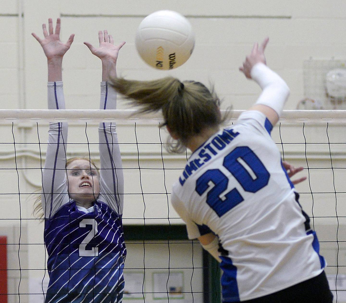 Dixon’s Madelyn set up to block a shot by Limestone’s Kennedey Barber in the first match during the Class 3A Sectional semifinal game on Monday, Oct. 31, 2022 at La Salle-Peru Township High School.