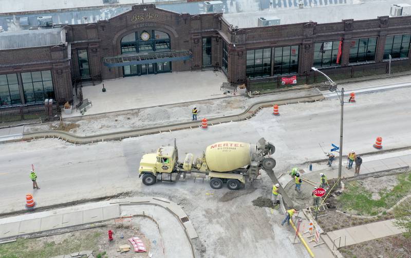 Crews pour a new sidewalk along U.S. 6 in front of the Westclox building on Monday, April 7, 2025 in Peru. The $6.4 million project is scheduled to be completed this summer, according to the release. a