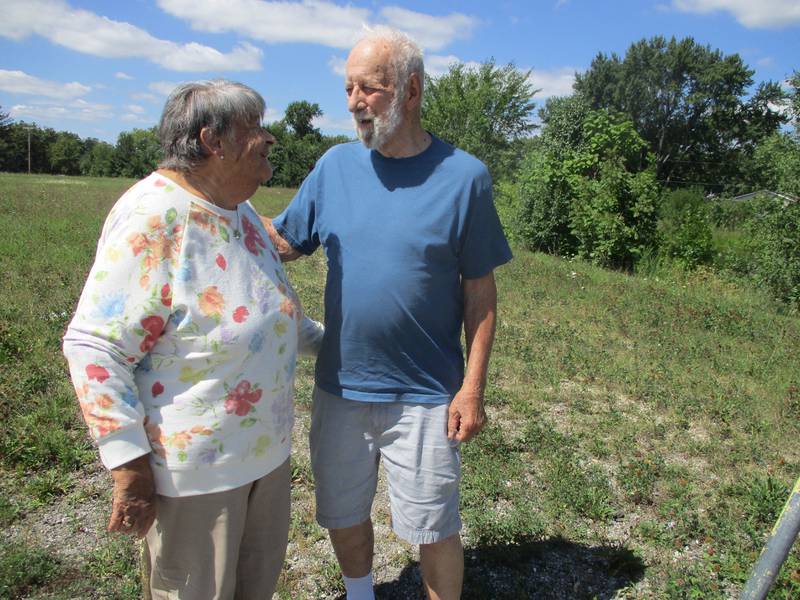 Susan and Allen Winter share a moment at the family property they inherited but had been unable to sell until a recent proposal to build a gas station on the Joliet site. Aug. 30, 2023.