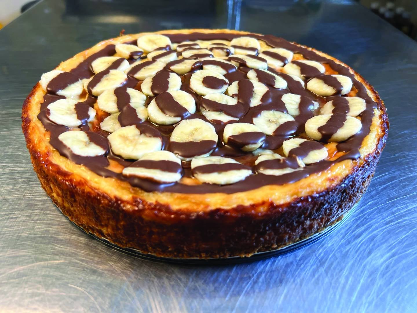 One of the specialty flavors available to order at Julie's Cheesecake Cafe is the banana chocolate cheesecake.