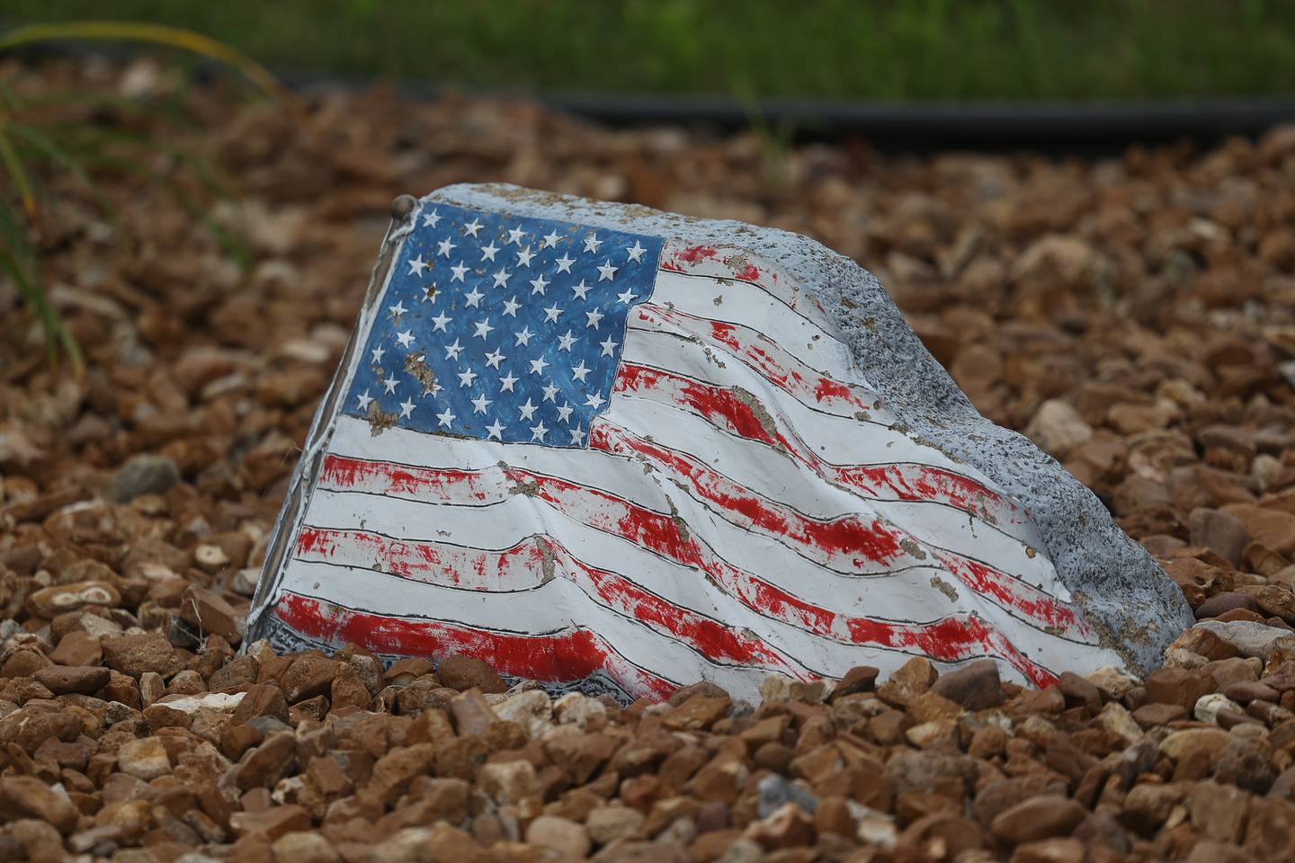 A stone flags greets guest at the home of Dan Miller, with the Wounded Warriors Project and K9s for Veterans, on Wednesday, July 24, 2024 in Joliet.