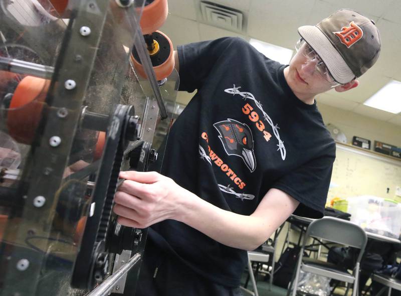 Blake Bollow, a senior at DeKalb High School, works on his teams robot during a Crowbotics team meeting Tuesday, April 10, 2024, at Huntley Middle School in DeKalb. Crowbotics is DeKalb High School’s robotics team who has qualified to compete in the FIRST Robotics Competition World Championship held in Houston, Texas April 17-20.