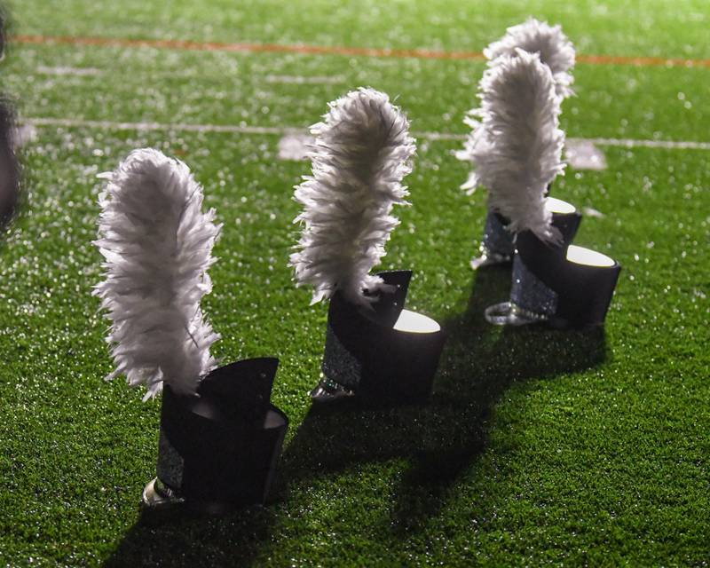 Downers Grove South band hats sit ready as they warm up before the Downers Grove South Marching Mustangs Musical Bowl held on Saturday Oct. 5, 2024, at Downers Grove South football field.