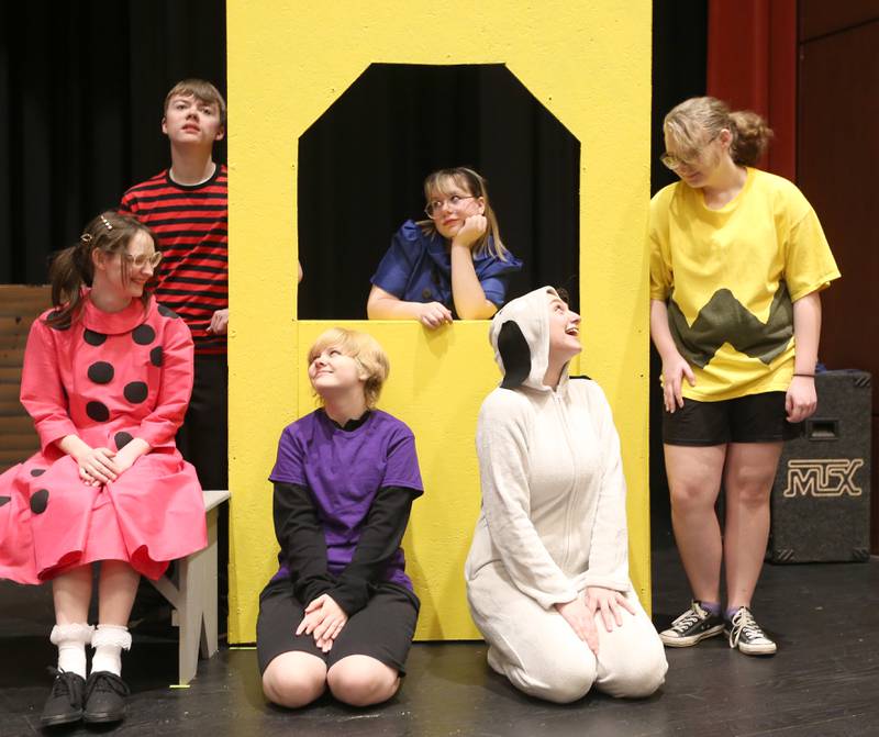 (Back from left) Sindney Davis as Linus, Grace Wozek as Lucy, Aarow Kleckner as Charlie (front from left) Allison Wozek as Sally, Vinny Philippe as Schroeder and Haley Campbell as Snoopy act in "You're a Good Man Charlie Brown" on Thursday, March 23, 2023 at Hall High School in Spring Valley. The show runs March 31 at 7p.m. and April 1 at 2p.m. in the auditorium at Hall High School. Tickets are $12 for adults and $10 for seniors and students. Tickets will be available at the door. The play is based on the comic strip "Peanuts." The play is directed by Megan Cullinan.