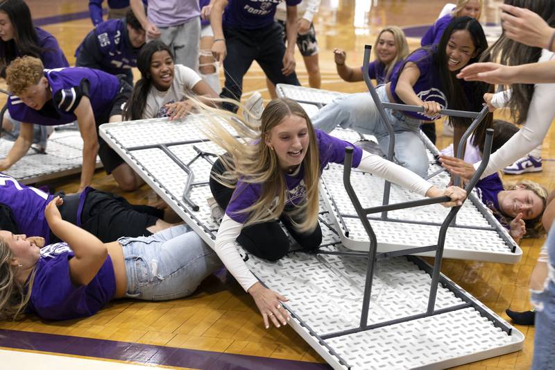 Grace Ackert dives across the end line to win the table surf competition for the sophomores Friday, Sept. 27, 2024, at Dixon High School.