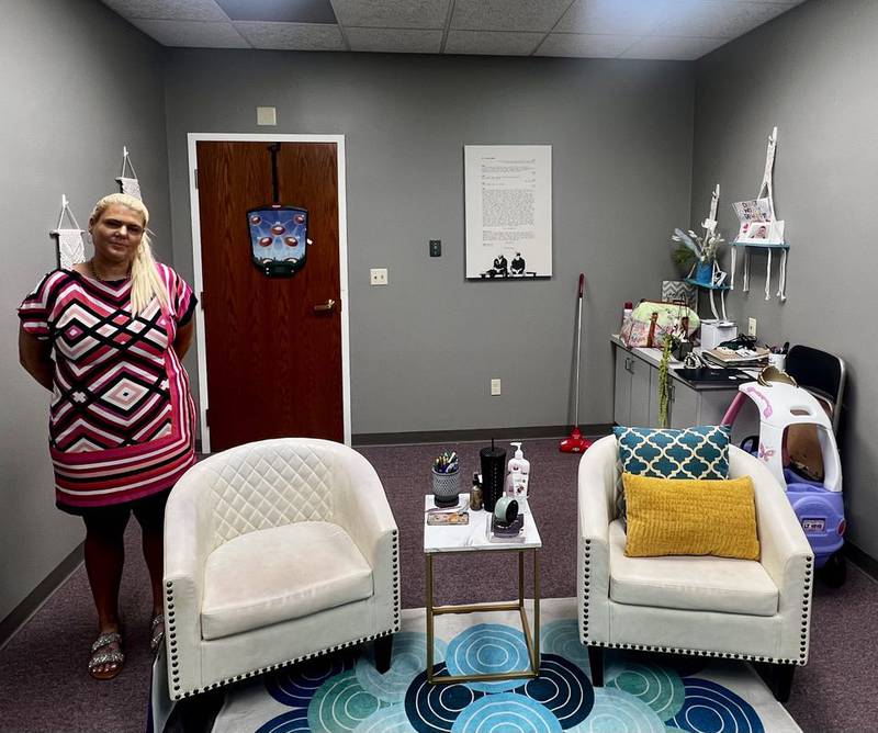 Christine Elston, owner of Elston Psychotherapy in Sterling, Illinois, stands in one of her client meeting rooms.