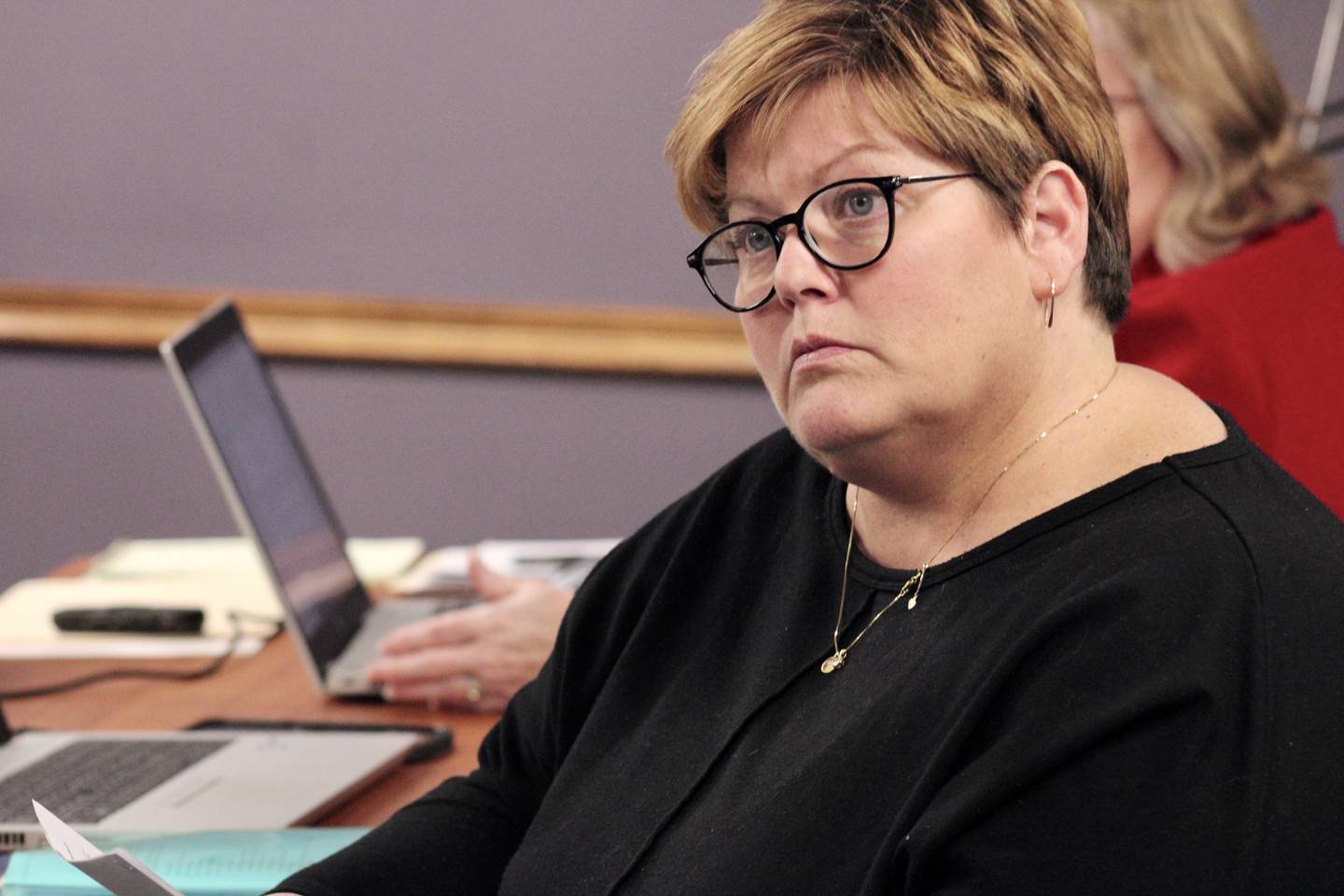 Dixon Public Schools Superintendent Margo Empen listens during a conversation with Marc Campbell prior to the start of the regular session of the Dec. 14, 2022, board of education.