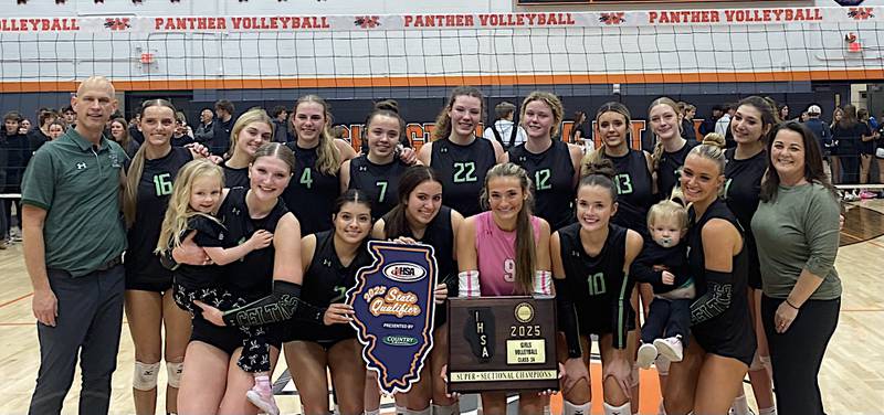 The Providence volleyball team shows off its Class 3A Washington Supersectional trophy after beating the hosts 25-21, 25-18 on Monday.