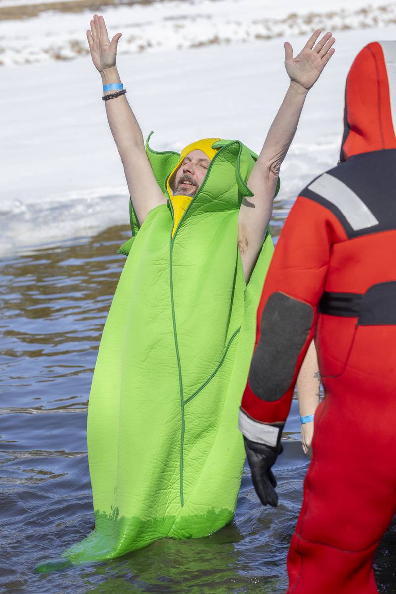 Charles Vanhorn falls backwards into the water during the Polar Plunge for Special Olympics on February 22, 2025 at Lake Mendota.