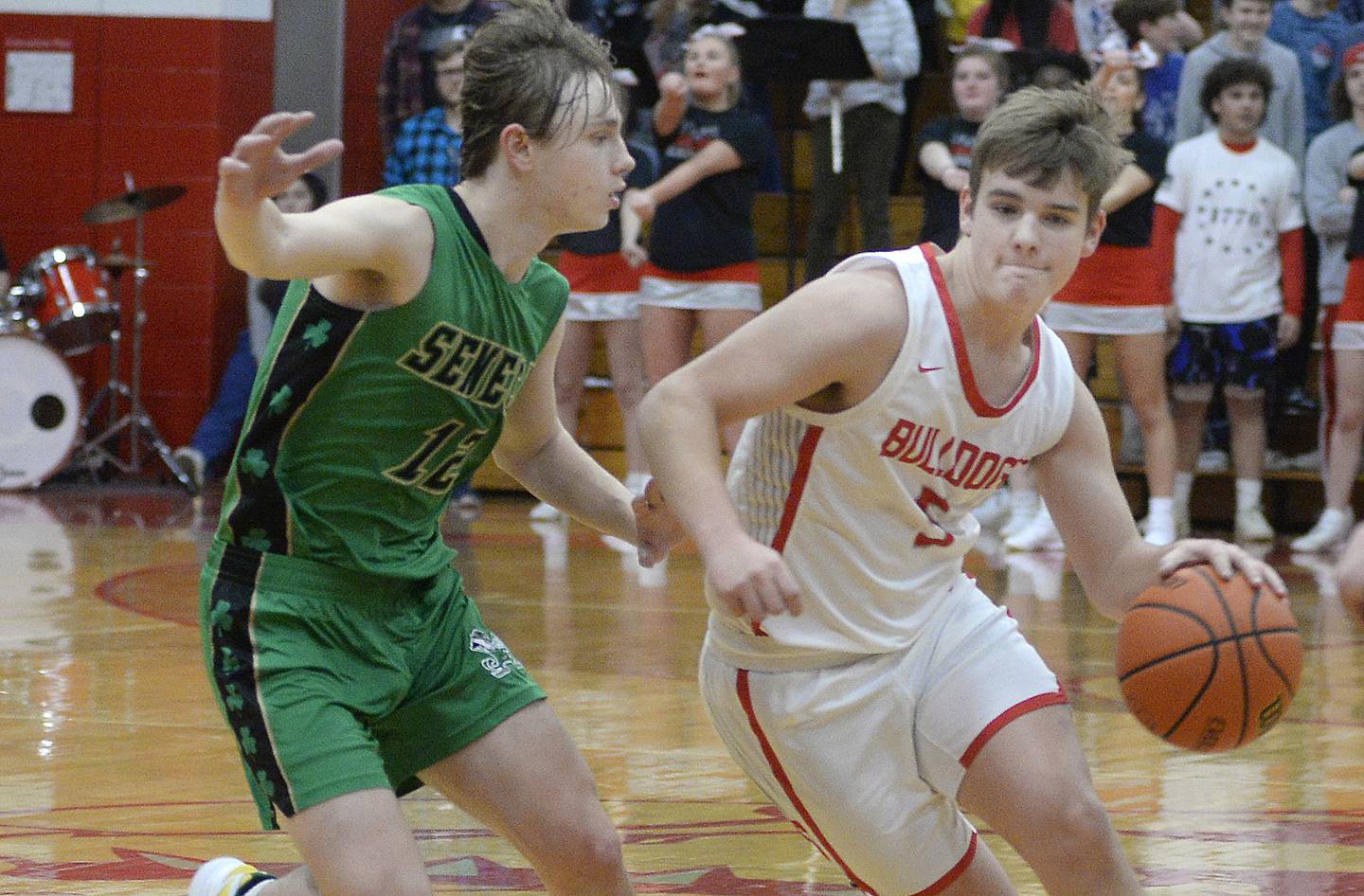 Streator’s Adam Williamson drives past Seneca’s Braden Ellis in the 2nd period in Pops Dale Gymnasium on Tuesday Feb. 7, 2023 at Streator High School.