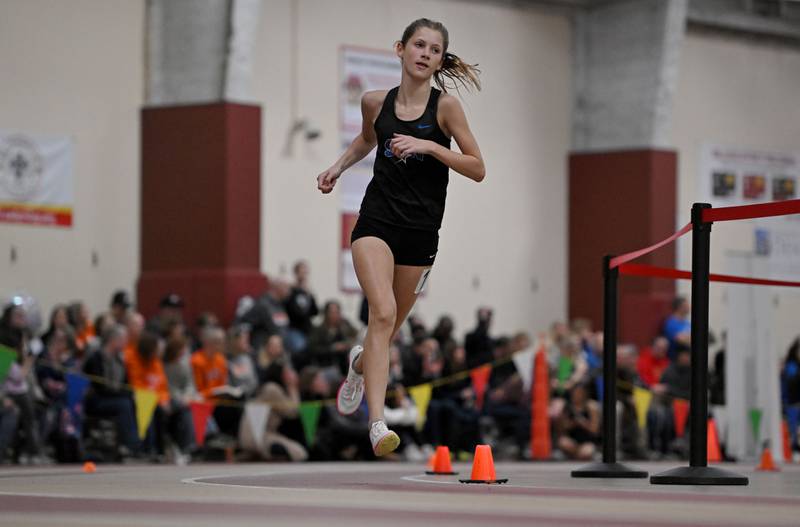 St. Charles North’s Gwen Hobson in the 3,200-meter run at the Dukane Conference girls indoor track and field meet at Batavia High School on Friday, March 15, 2024.