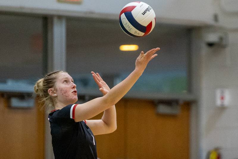 Jaylei Leininger (1) of Woodland serves ball on Thursday, Sept. 11, 2025 at Abbot Vincent Gymnasium in Peru.