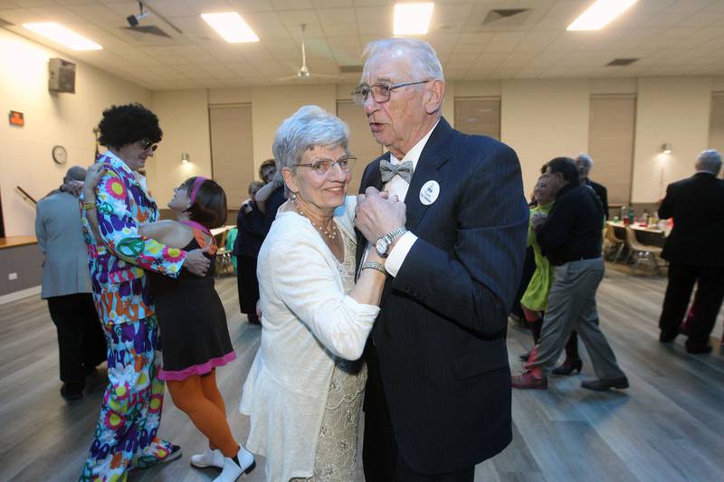 Virginia and Tom Stasiak dance to a Frank Sinatra song during the Senior Prom to celebrate the 50th Anniversary of Leisure Village in Fox Lake