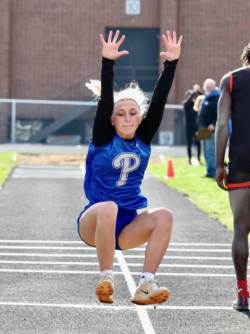 Princeton's Ashlynn Weber lands for a first place long jump in Monday's Ferris Invite at Princeton.