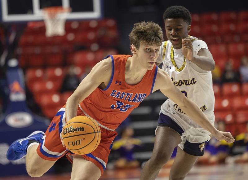 Eastland’s Parker Krogman drives to the hoop against Peoria Christian Thursday, March 13, 2025, during the Class 1A boys basketball state semifinal.