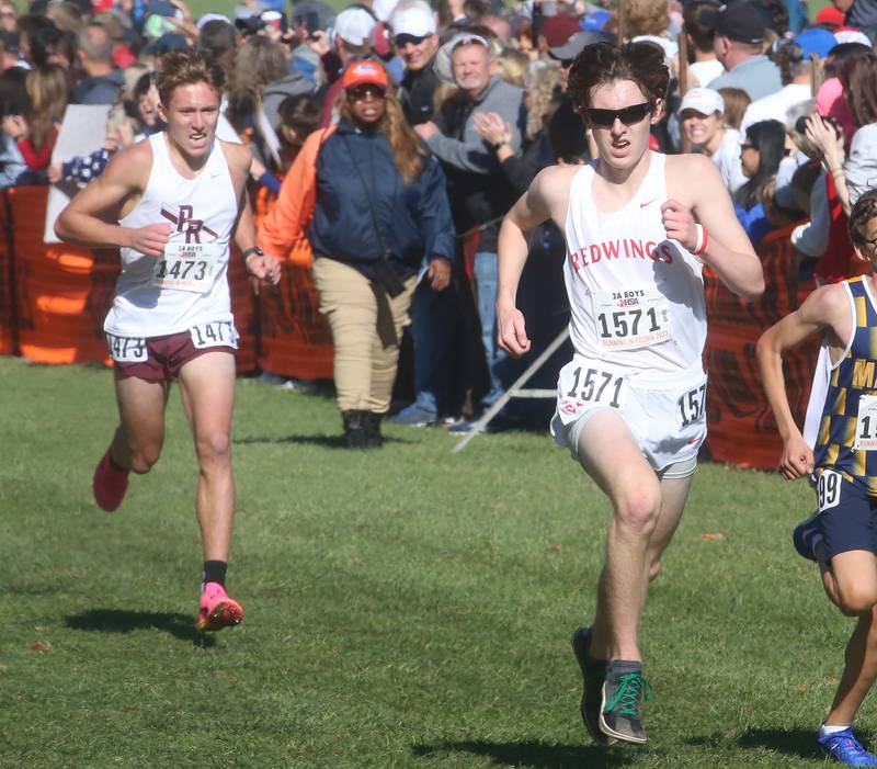 Prairie Ridge's Gerrit Dam and Benet Academy's Aiden Hulett compete in the Class 2A State Cross Country race on Saturday, Nov. 4, 2023 at Detweiller Park in Peoria.