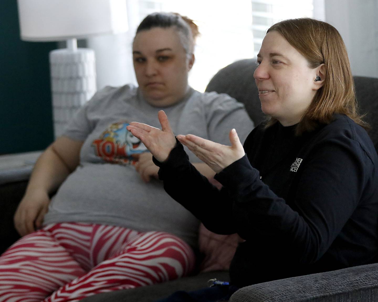 Jackie Medina (right) and Brittany Woods talk in home on Tuesday, March 13, 2025. The home is Clearbrook's new community integrated living arrangement home for adults with developmental disabilities in Woodstock.