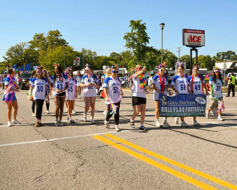 Members of the Geneva High School girl's flag football team walk during the Geneva High School Homecoming Parade on Friday, Sept. 26, 2025, along State Street downtown.