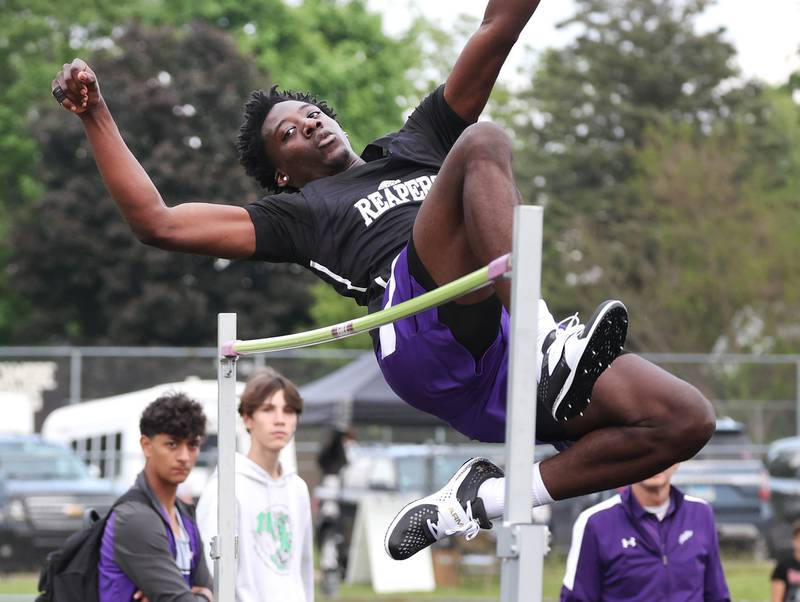 Plano’s  Christ Keleba clears the bar in the high jump Thursday, May 16, 2024, during the Class 2A boys track sectional at Sycamore High School.