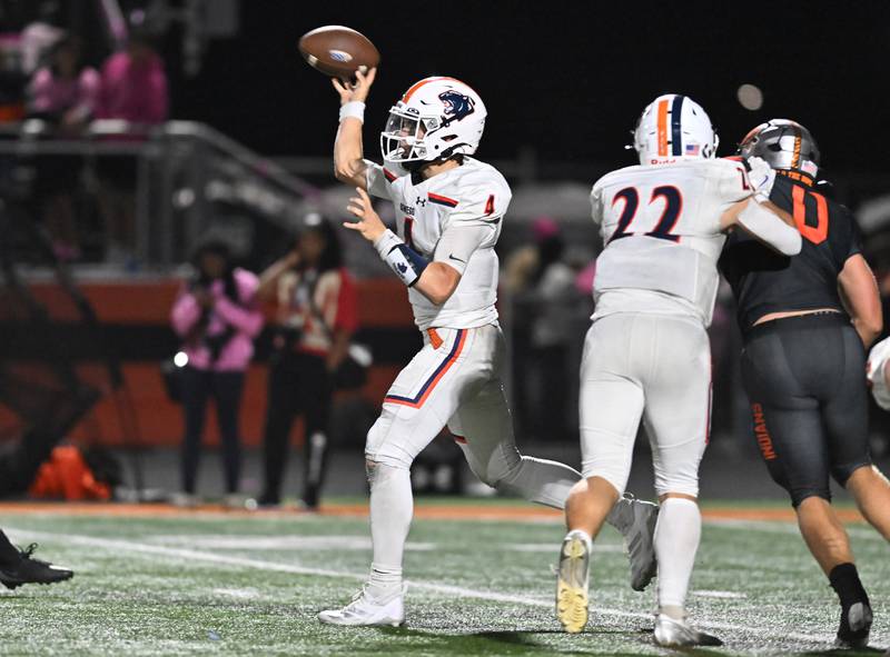 Oswego's Drew Kleinhans (4) throws a pass during the conference game against Minooka on Friday, OCT. 10, 2025, at Minooka.