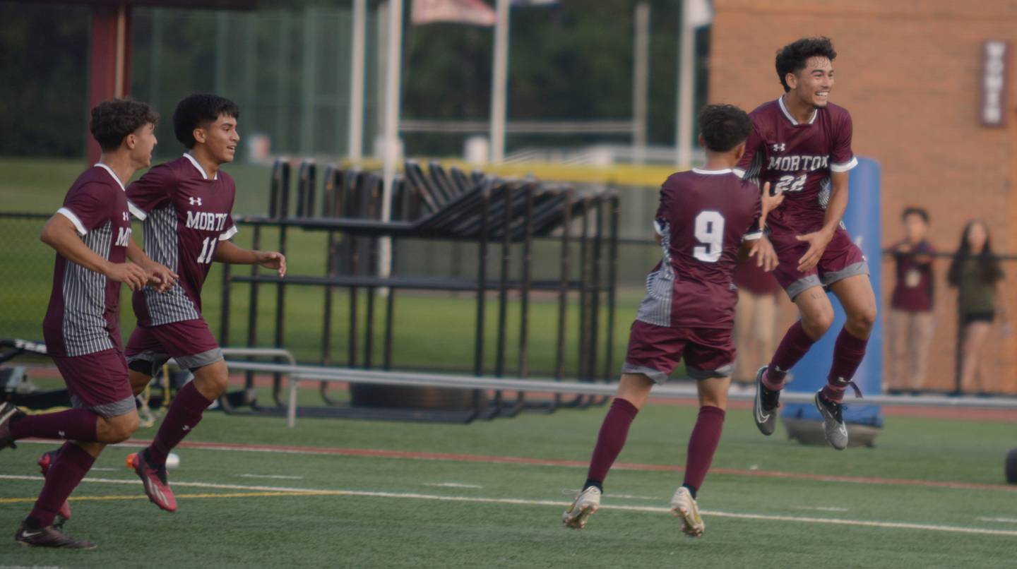 Morton West's Max Aquino and his teammates celebrate a goal against Naperville Central during their home game in Berwyn Monday, Aug. 21, 2023.