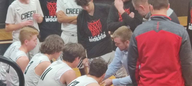 Indian Creek coach Nolan Govig talks to his team during a timeout against DePue on Tuesday, January 10, 2023.