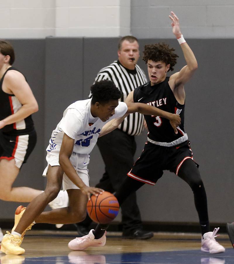Burlington Central's Jordan Moore tries to drive on Huntley's Lucas Crosby during a Fox Valley Conference boys basketball game on Friday, Dec. 15, 2023, at Burlington Central High School.
