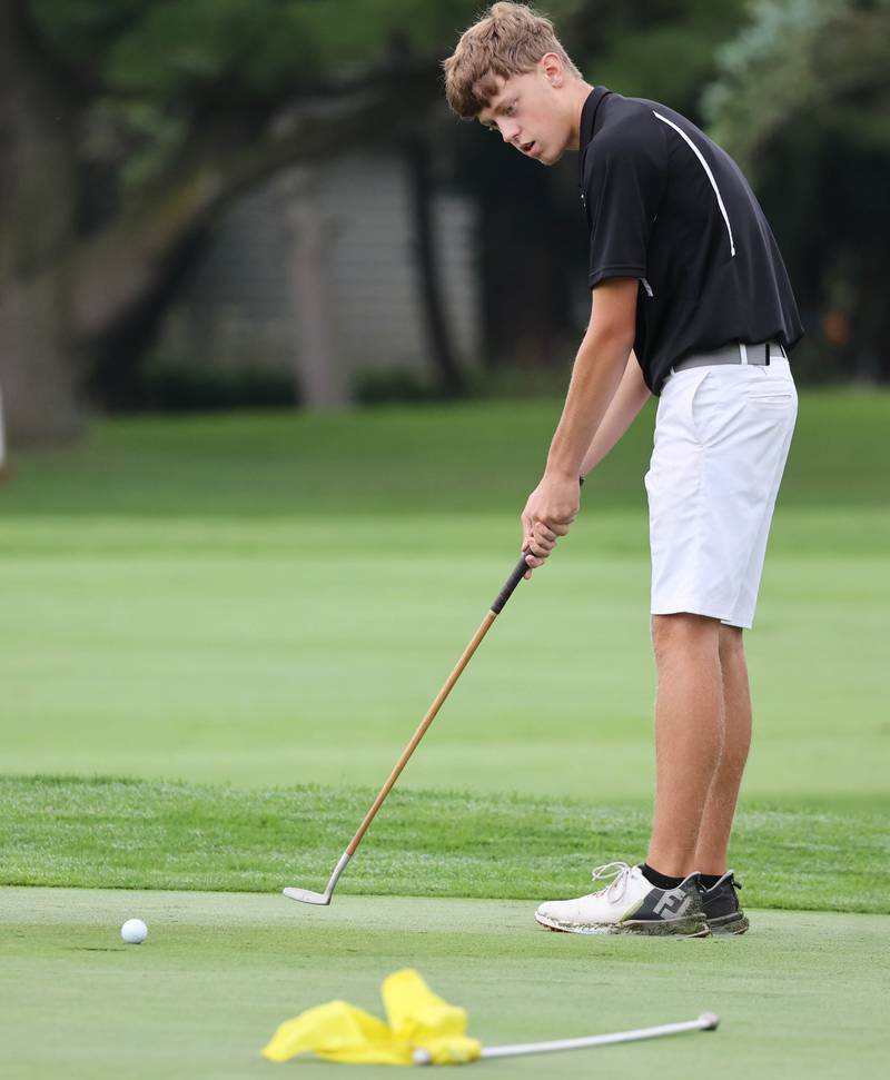 Kaneland’s Brian Davoust putts on the seventh green Wednesday, Sept. 27, 2023, during the Class 2A boys golf regional at Sycamore Golf Club.
