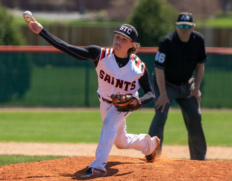 St. Charles East's Keegan Tracey (2) delivers a pitch against St. Charles North during a baseball game at St. Charles East High School on Saturday, May 7, 2022.