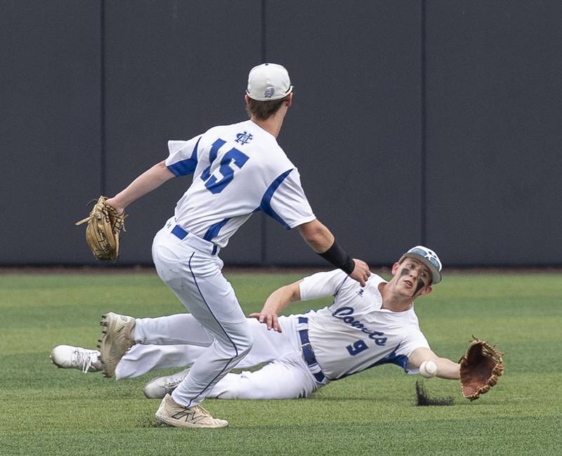 Newman’s Joe Oswalt slides but the ball falls just in front against Eureka Saturday, June 7, 2025, during the Class 2A state baseball third place game at Illinois Field in Champaign.