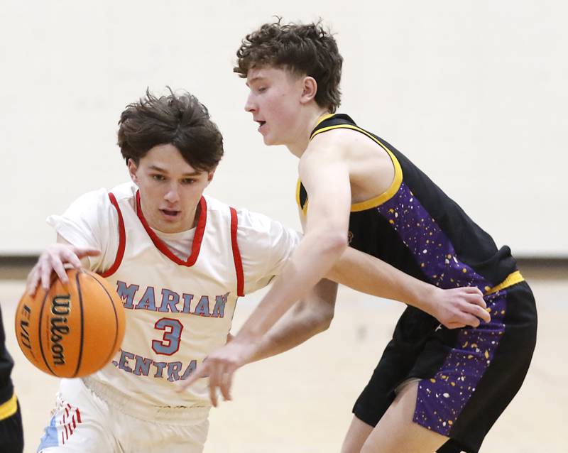 Marian Central's Logan Brandt drives to the basket against Chicago Christian's Casey Lenarz during a Chicagoland Christian Conference basketball game on Tuesday, Jan. 21, 2025, at Marian Central High School.