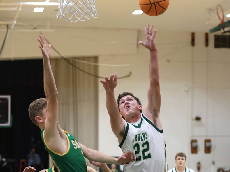 St. Bede's AJ Hermes lets go of a shot under the hoop over Seneca's Matt Stach on Tuesday, Dec. 16, 2025 at St. Bede Academy.