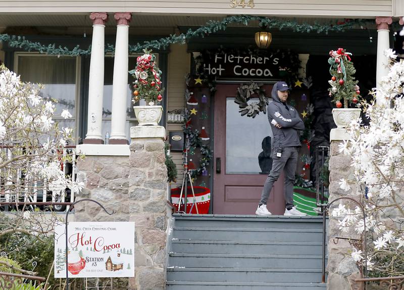 A crew member stands outside as a scene for the “Exes of Christmas Past,” is filmed on Friday April 25, 2025, at the Cherry Tree Inn in Woodstock.